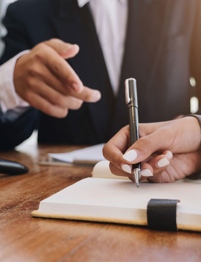 Professional business meeting discussing corporate and commercial legal advice at Lutz Law